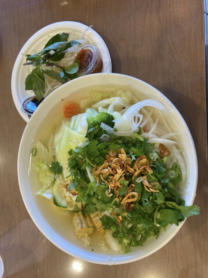 Before: a plain phone photo of a bowl of tofu and veggie pho, with no text, price or location